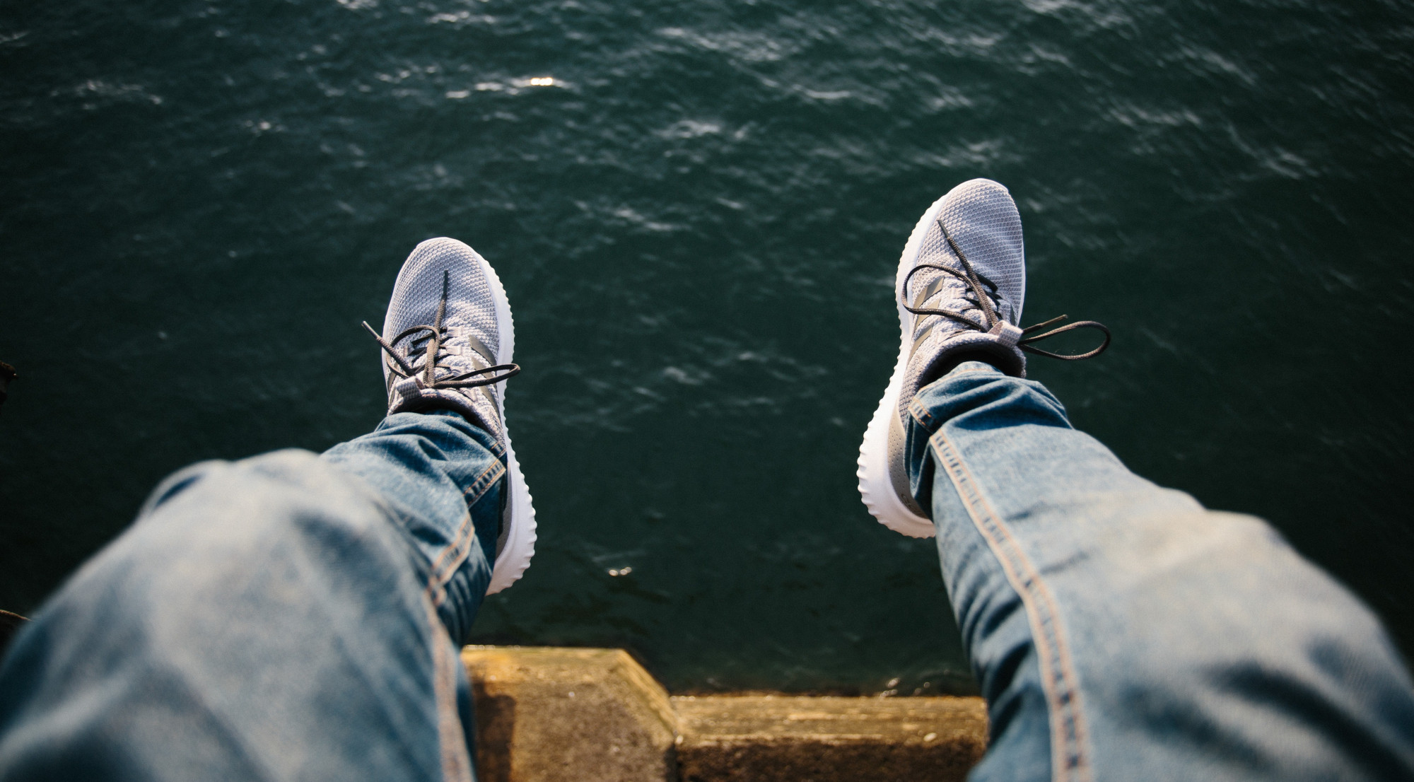 mindfulmedicine.co.uk image: Photo of someone dangling their legs over water